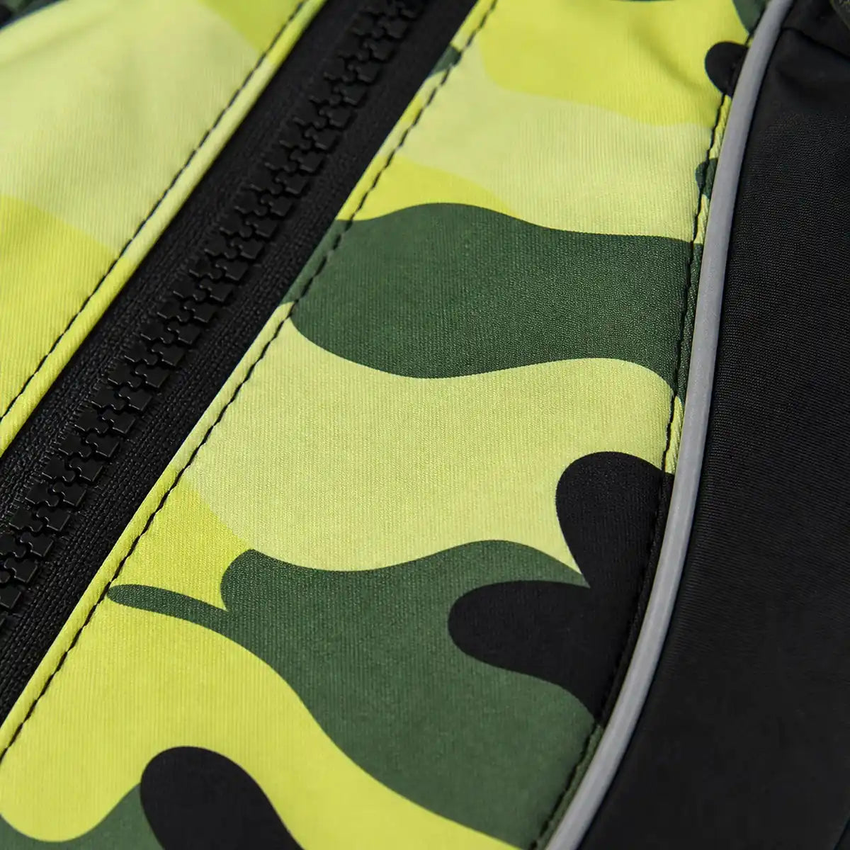 Macro detail of the green camouflage vest fabric, zipper and reflective piping