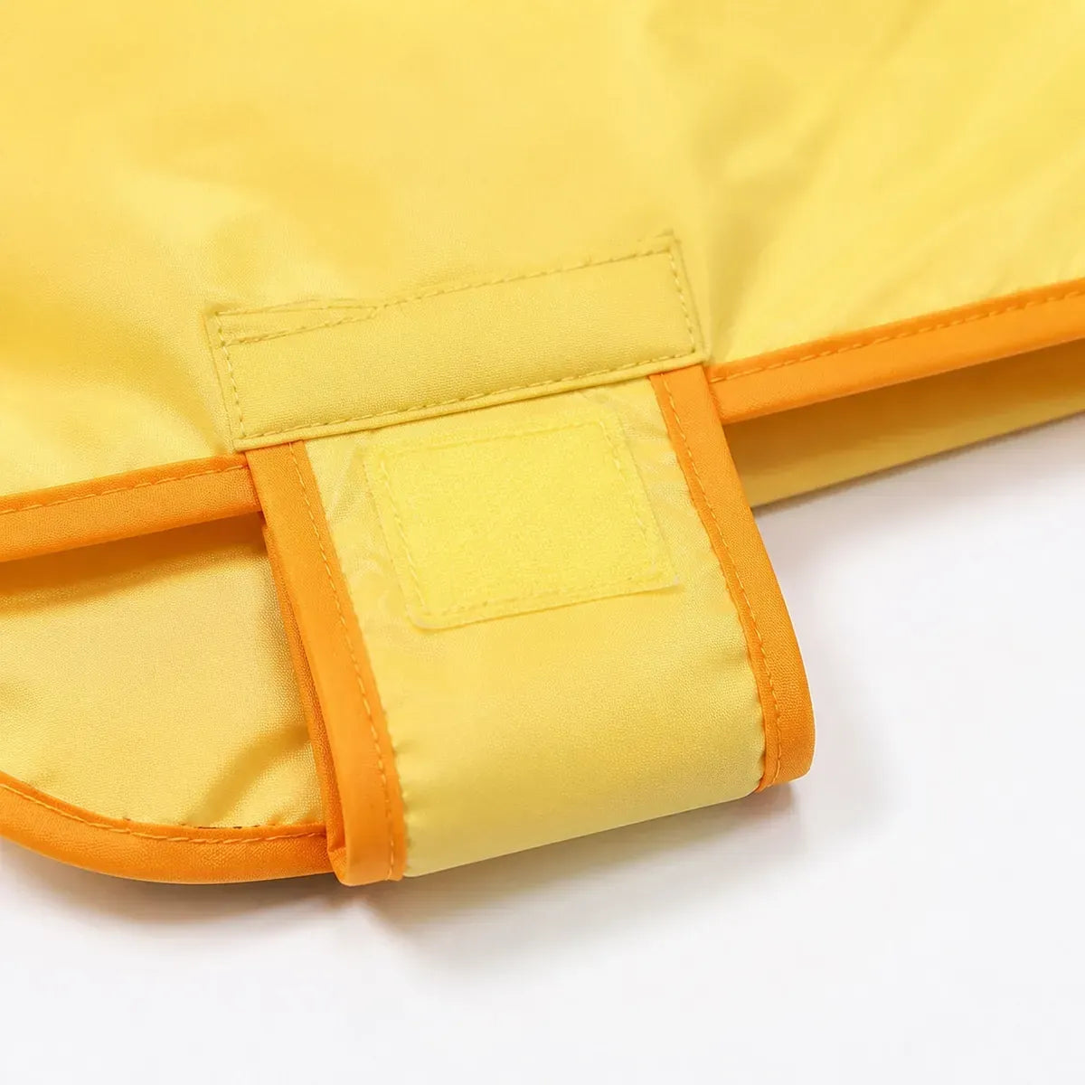Close detail of Duck Cape Dog Raincoat showing visible texture and construction