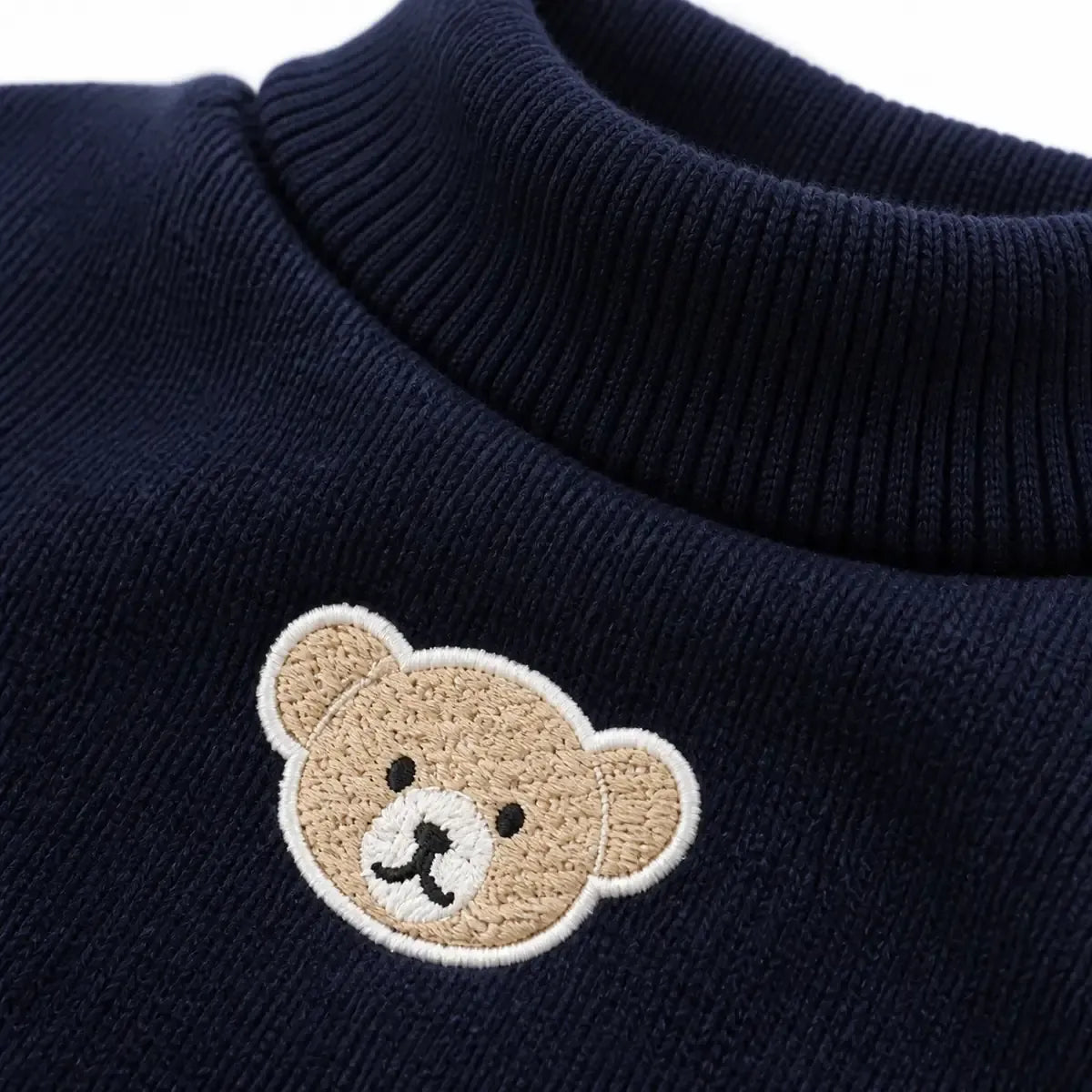Close detail of Bear Patch Cat Sweater showing visible texture and construction