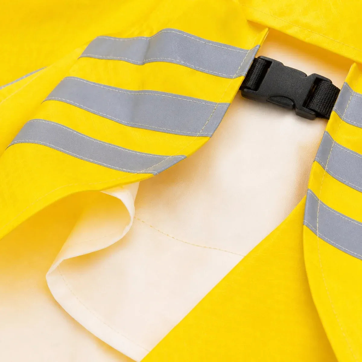 Close detail of Reflective Hooded Dog Raincoat showing visible texture and construction