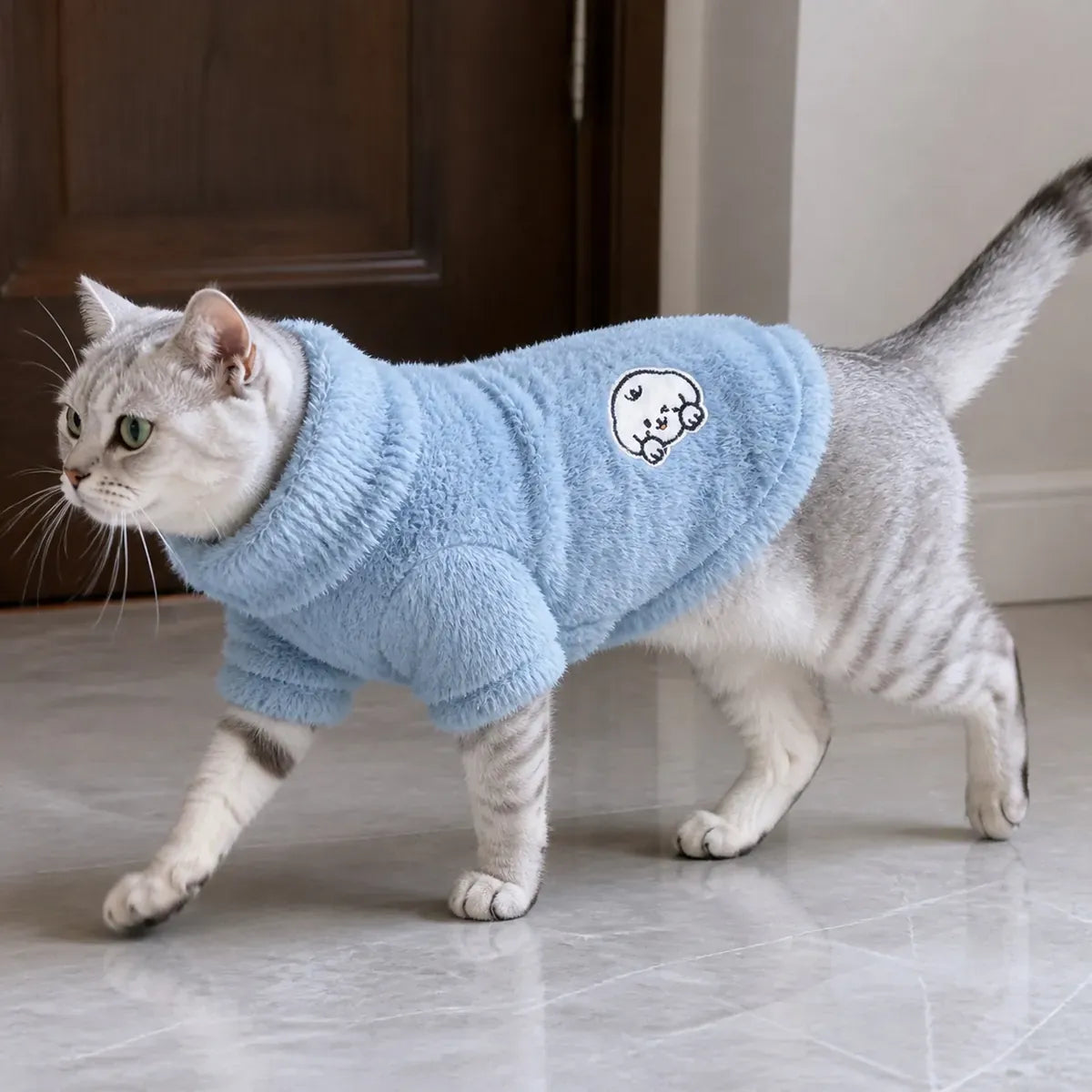 Three-Color Hooded Cat Sweatshirt worn by a cat during an everyday outing