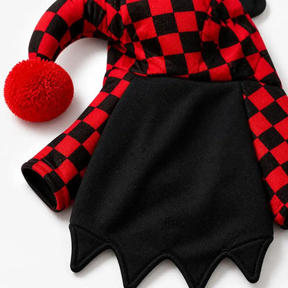 Close view of checkerboard sleeves, black body and pointed hem