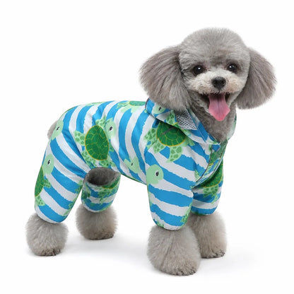 Blue turtle print dog raincoat worn by a dog on a white background