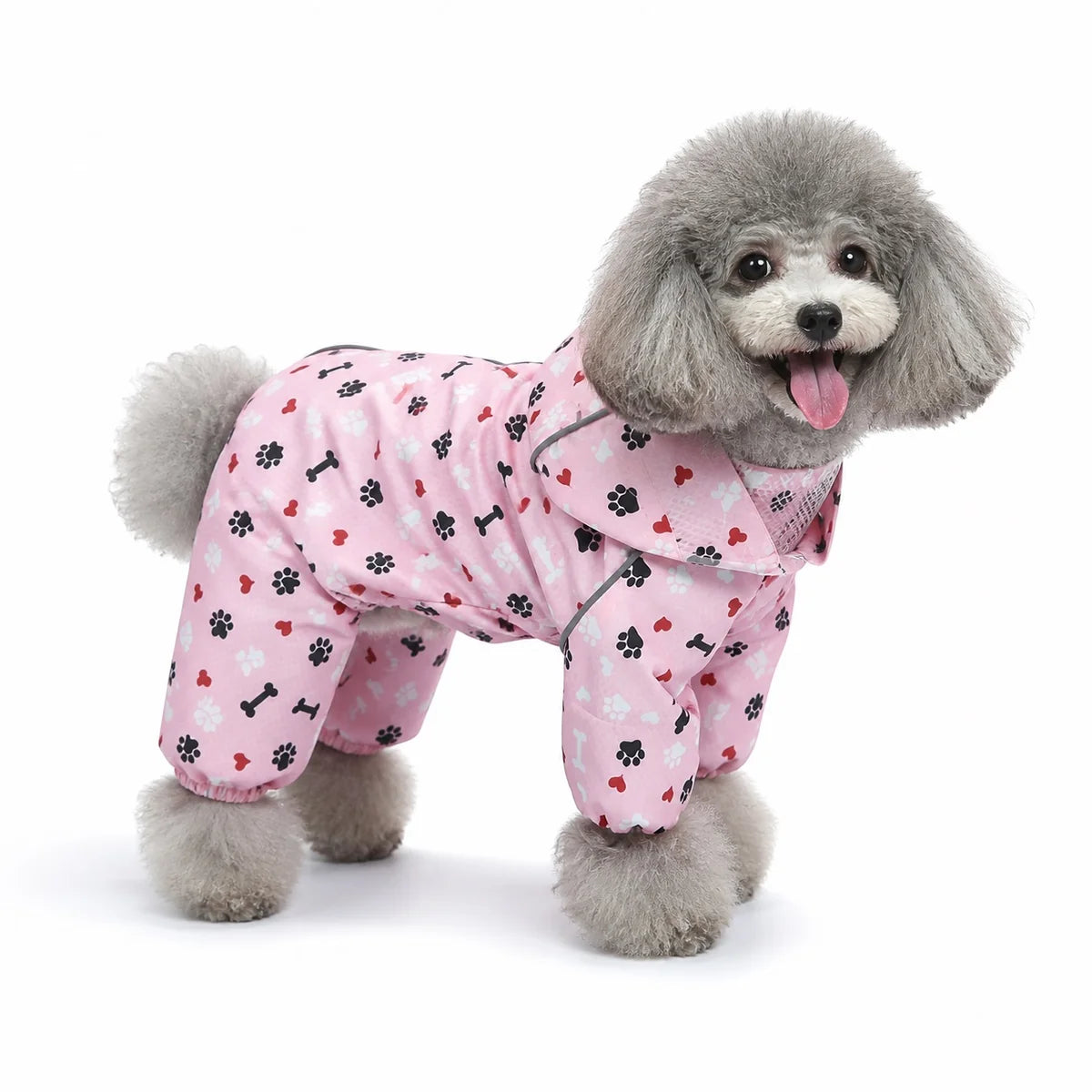 Pink heart bone print dog raincoat worn by a dog on a white background