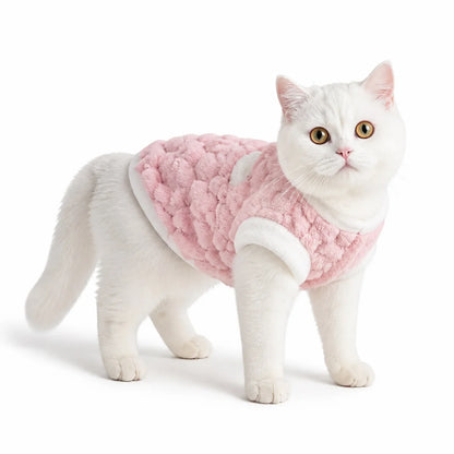 Pink plush pet vest worn by a pet on a white background