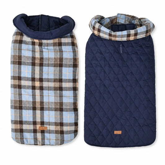 Blue reversible padded dog coat shown alone on a white background