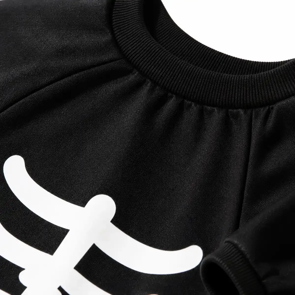 Close-up of the black skeleton dog costume neckline and fabric detail