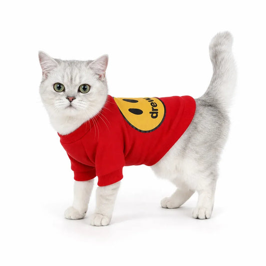 Red smile patch pet sweatshirt worn by a pet on a white background
