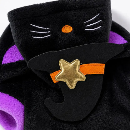 Close view of black plush texture, purple trim and gold star applique